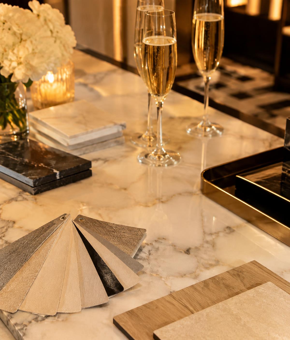 Illustrative stone and flooring samples with refreshments